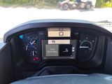 a car dashboard with a digital display on it