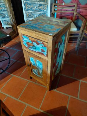 a wooden cabinet with a drawer on top of a tile floor