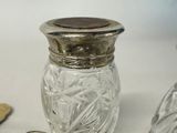 a small glass jar with a coin on the table