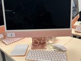 a desk with a computer, keyboard, mouse and mouse on it