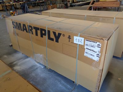 a large cardboard box sitting on a pallet in a warehouse