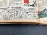 an old comic book open on a table