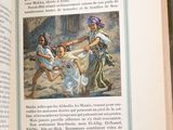 an open book with a picture of a woman and two children