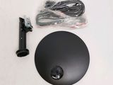 a black object on a white surface with wires and wires