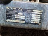 a close up of a metal sign on the side of a vehicle