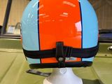 a helmet sitting on top of a table in a room