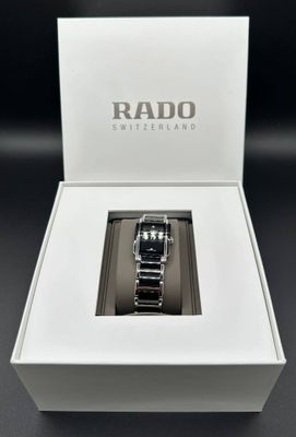 a close up of a watch in a white box on a table