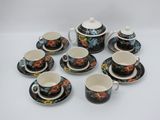 a close up of a group of cups and saucers on a table