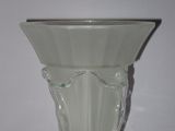 a glass vase that is sitting on a table