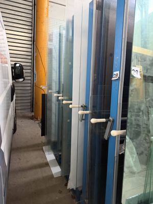 many glass doors that are lined up in a room