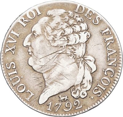 a silver coin with a woman holding a flower in her hand