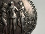 a silver locke with a picture of three women on it
