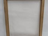an empty picture frame with a white background and a white background