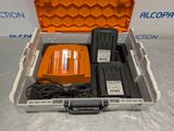 an orange case with two batteries and a charger in it