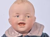 a small doll that is sitting on a table