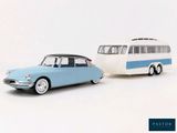 two toy cars that are next to each other on a white surface