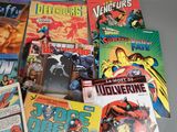 a lot of comic books sitting on a table