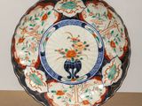 a plate that has a blue and orange design on it