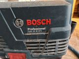 a close up of a bosch power tool on a table