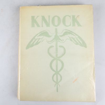 une image représentant un livre sur lequel figure un symbole médical
