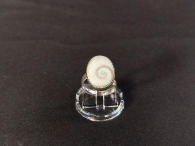 a close up of a small glass object on a table