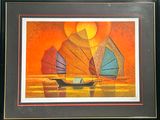 tableau représentant un voilier aux voiles colorées sur l'océan au coucher du soleil