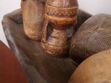 three wooden vases sitting on top of a wooden shelf