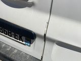 a close up of a car door handle with a sticker on it