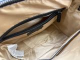 a purse that has a zipper on the inside of it
