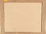 an old picture frame on a wall with a yellow sticker on it