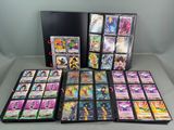a collection of pokemon cards are displayed on a table