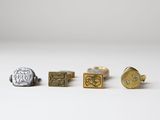 three pairs of gold and silver cuff rings