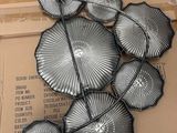 a bunch of umbrellas that are on a cardboard box