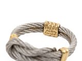 a close up of a cable bracelet with a gold clasp