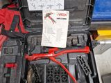 a tool case with tools in it sitting on the floor