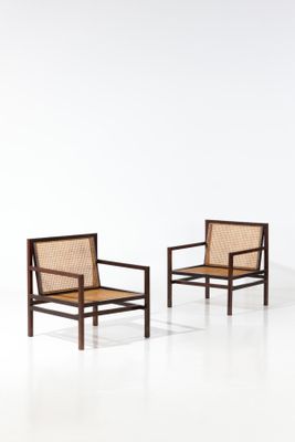 two chairs in a white room with a white floor and a white wall