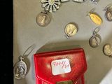 a display of silver and gold jewelry on a table