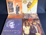 four vinyl albums of madonna, queen and queen of rock and roll