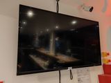 a flat screen tv mounted on the wall in a room