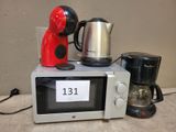 a microwave and a coffee maker sitting on top of a counter