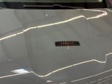 a sticker on the hood of a car that has a sticker on it