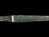 a knife that is sitting on a black surface