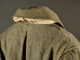 jacket worn by a man in a military uniform with a hood on