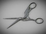 a close up of a pair of scissors on a table