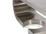 a stainless steel table with a curved design on it