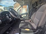 a seat in the back of a van with a bag in it