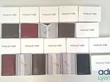 many different shades of eyeshadow in a box