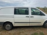 a white van parked on the side of the road