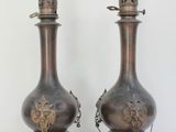 two vases that are sitting on a table