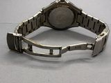 an image of a close up of a wrist watch on a table